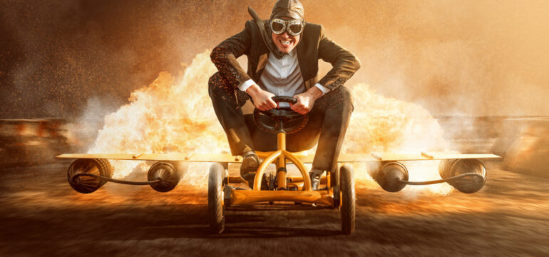 Businessman,On,A,Pedal,Car,With,A,Rocket,Engine